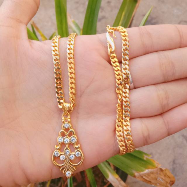 kalung berbahan dasar koin uang 1991