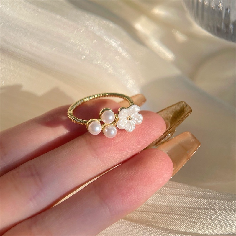 Cincin Model Terbuka Desain Bunga Aksen Mutiara Bahan Zirkon Gaya Korea Untuk Wanita