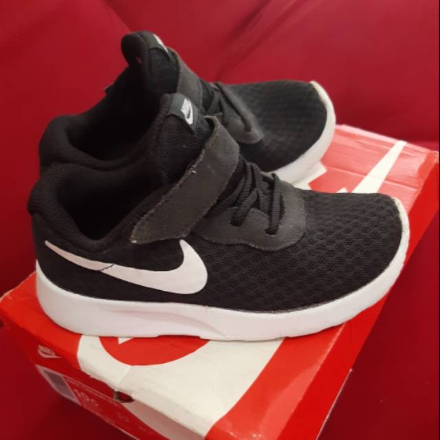 nike tanjun size 4