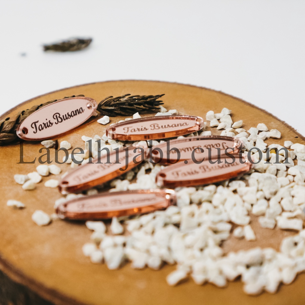 

label hijab | label baju | label akrilik | custom label | label jilbab | label cutting | label gamis