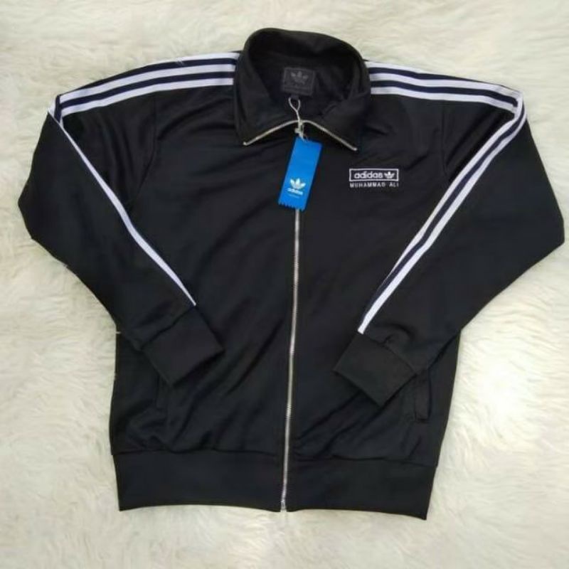 JAKET ADIDAS MUHAMMAD ALI JAKET ORIGINAL JAKET HOODIE ADIDAS JAKET PRIA/ASTROB.ID/JAKET ORIGINAL/JAK