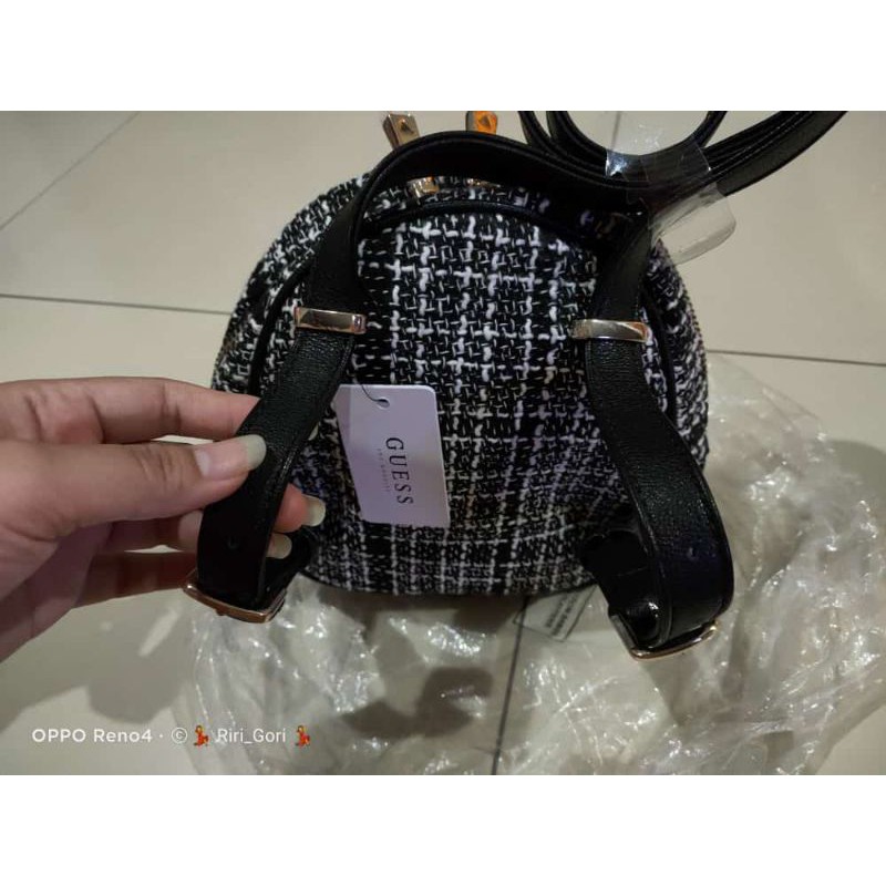 Guess original sling bag backpack