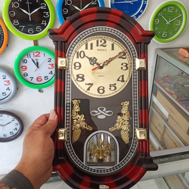 Jam Dinding NIKKO Bunyi Setiap Jam Dengan Bandul yang Berputar