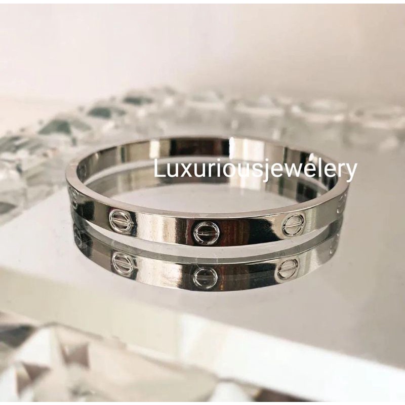 Gelang bangle tittanium ada grafir logo