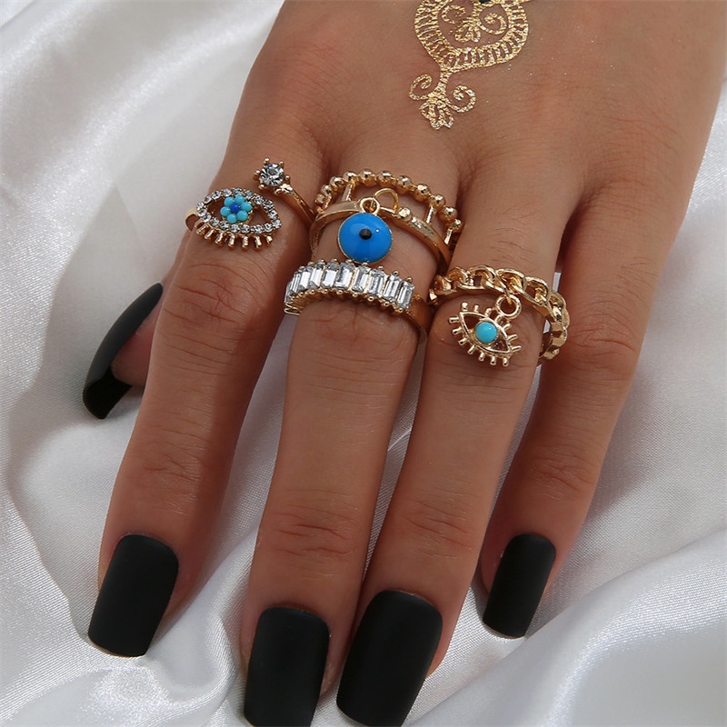 4pcs / Set Cincin Desain Mata Setan Aksen Berlian Model Hollow Gaya Punk Untuk Wanita