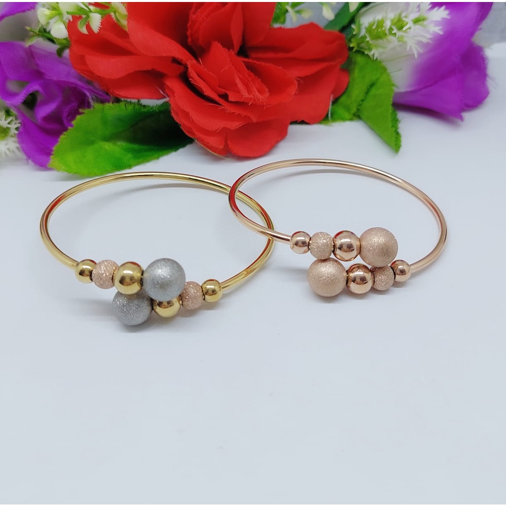 Titanium gelang dan cincin biji bola A.B