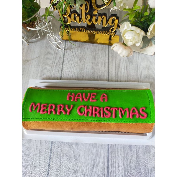 

Tambahan tulisan di Bolu gulung