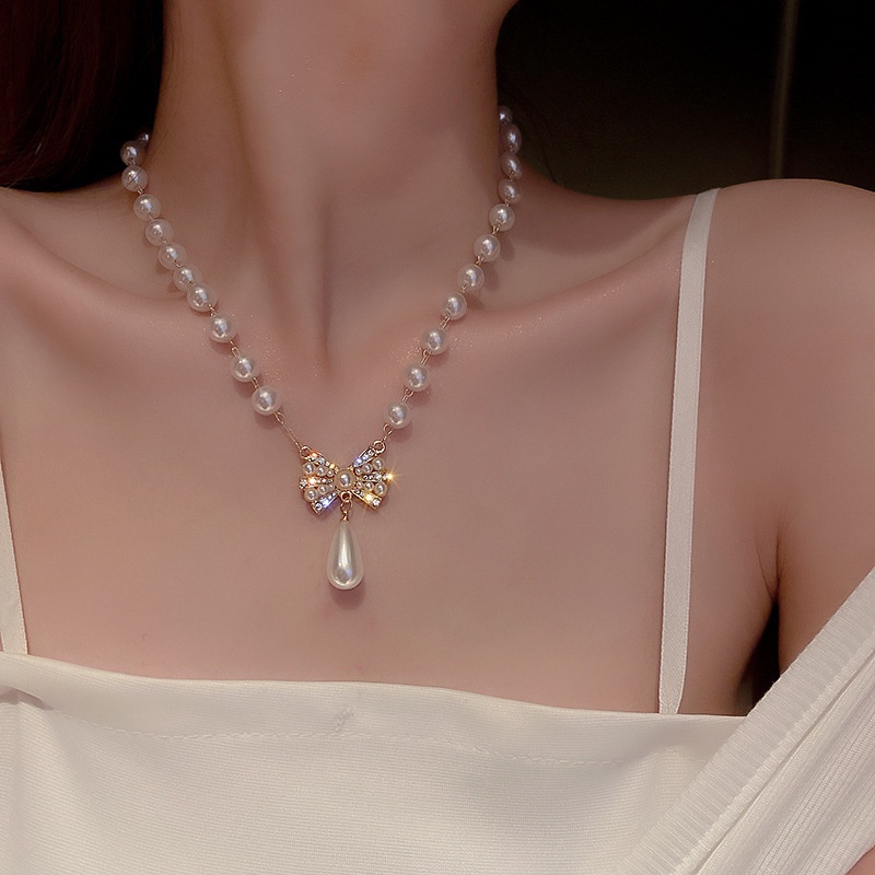 Kalung Rantai Model Rumbai Aksen Bunga Mutiara Dan Berlian Gaya Retro Untuk Wanita