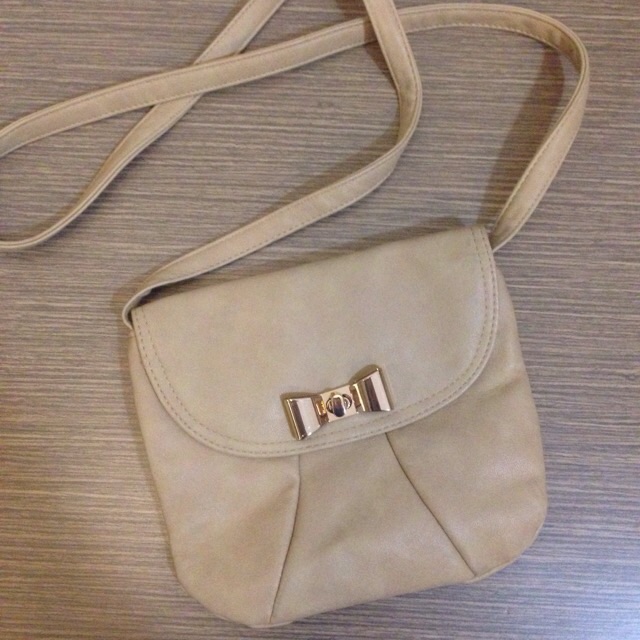 stradivarius gold bow mini bag