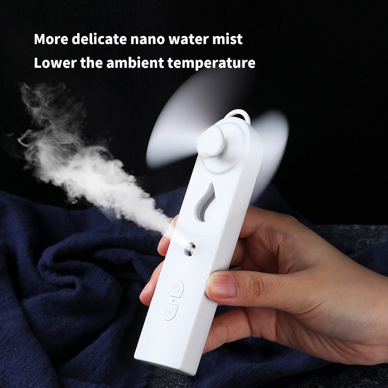 【COD/Pengiriman Cepat】Kipas Genggam Multifungsi Angin 2 in 1 dengan Humidifier Pocket Fan  Nano Spray Kipas Humidifier Pocket Fan USB Rechargeable Kipas Angin Mini Perawatan Wajah  Moisturizing And Hydrating Air Humidifier Aroma Difusier Essential Oil