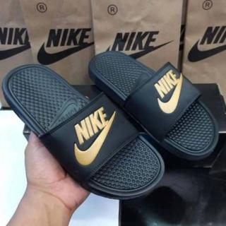 nike flip flops gold nike sign