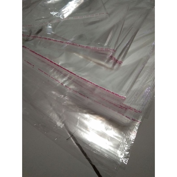 

TERMURAH plastik opp seal lem ukuran 25x35 plastik packing baju plastik opp seal bolong
