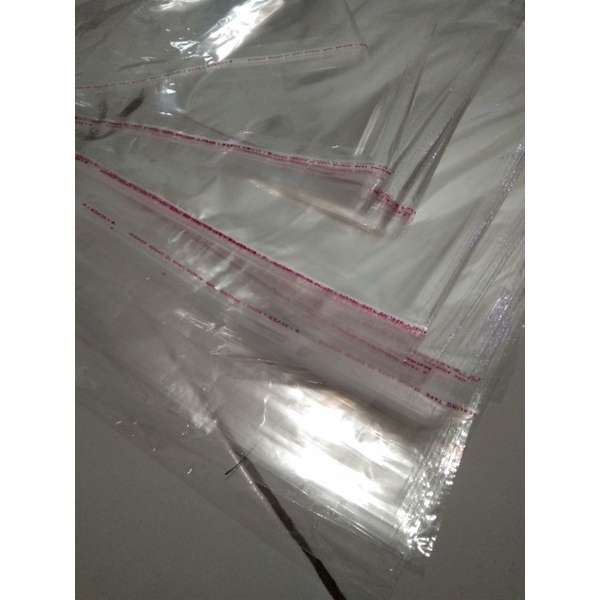 TERMURAH plastik opp seal lem ukuran 25x35 plastik packing baju plastik opp seal bolong