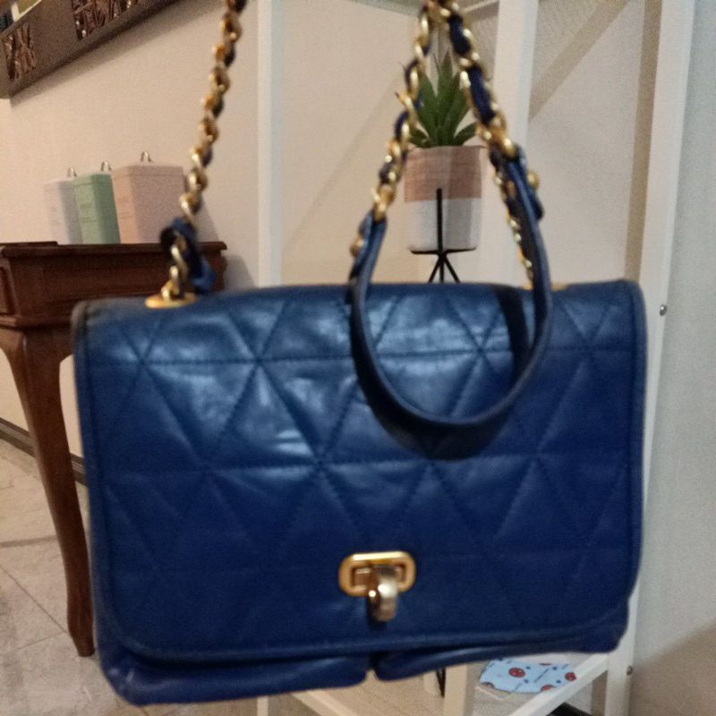 tas sling anne klein kepala singa