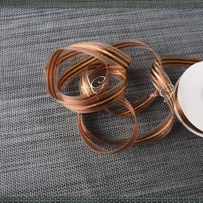 

Pita Organdi - Coklat; Lebar 1.8cm; Panjang 25 Yard
