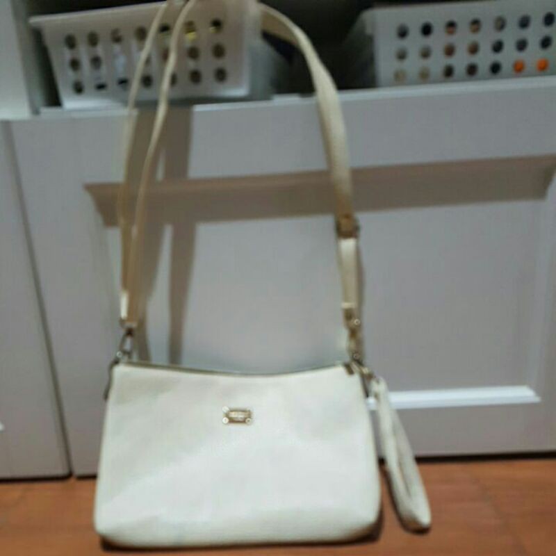 preloved sling bag krem WPS