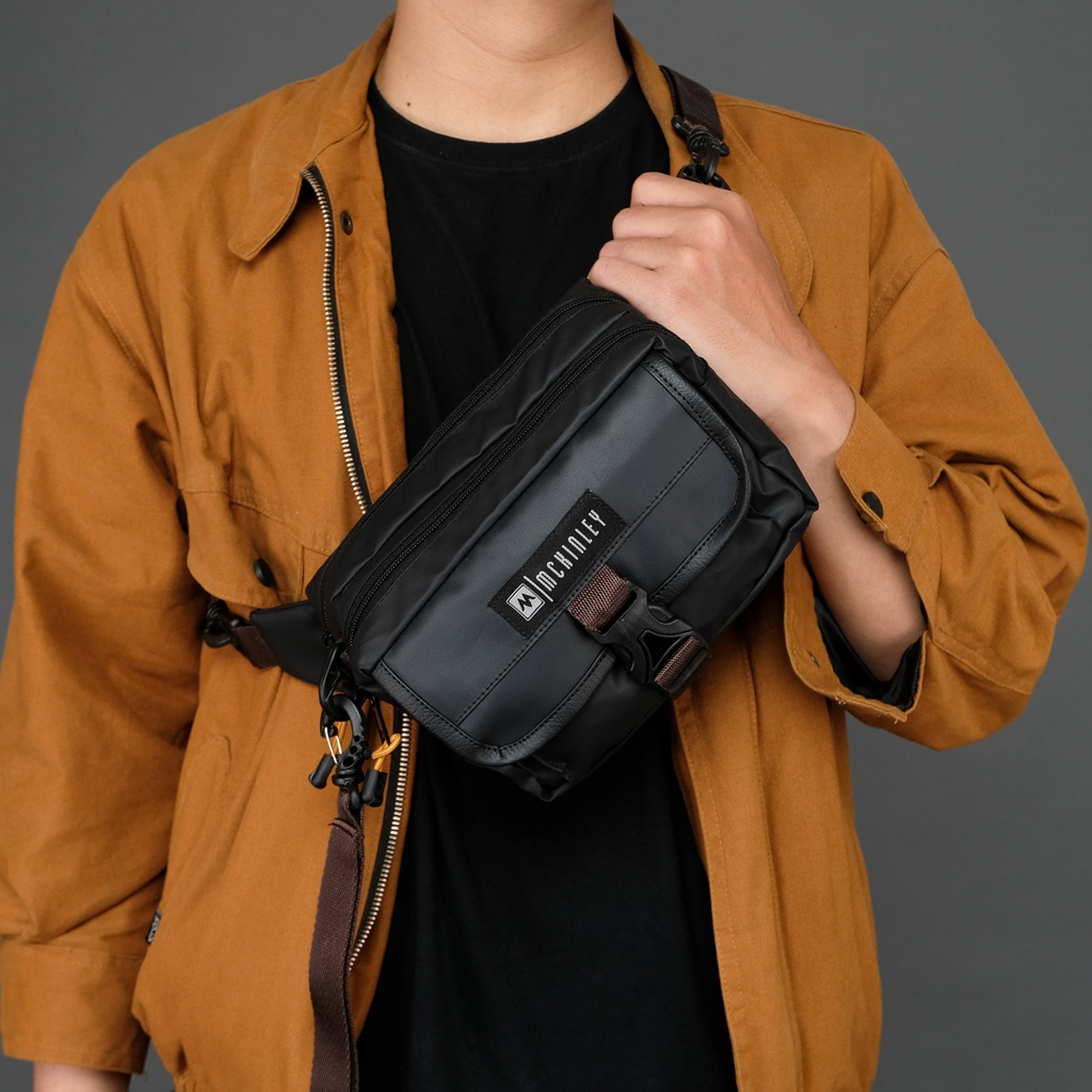 MORIA BLACK ORIGINAL x MCKINLEY Tas Selempang Hitam Pria Slingbag Casual Multifungsi Jalan Santai Main Hangout Nongkrong Sling Bag Distro Remaja Dewasa Daily Shoulder Bag Premium Shoulderbag Simple Pouch Clutch Bag Tas Slempang Bahu Dada Keren Terbaru