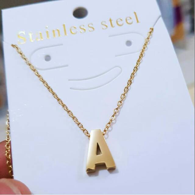 Kalung huruf titanium kecil