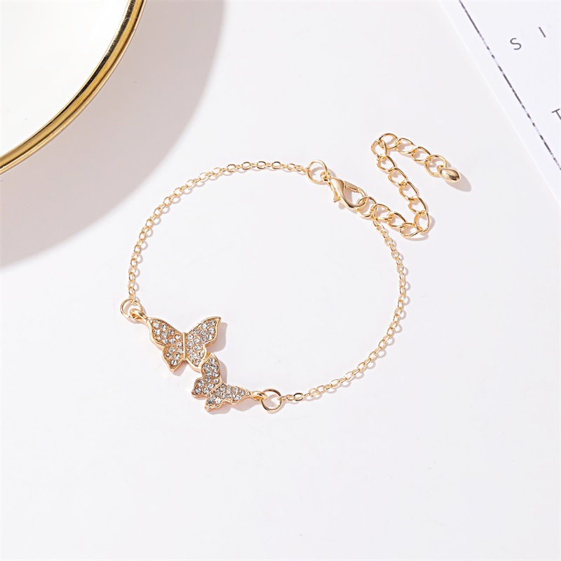 Gelang Rantai Desain Double Butterfly Bahan Cubic Zirconia Warna Emas Untuk Wanita