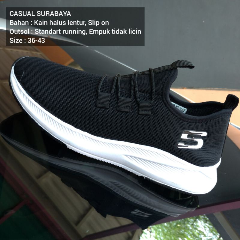 Sepatu Santai Slip on Skechers Hitam Putih Bahan Elastis Lentur