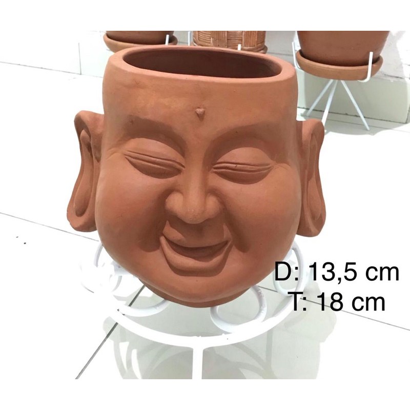 Pot tanah liat wajah