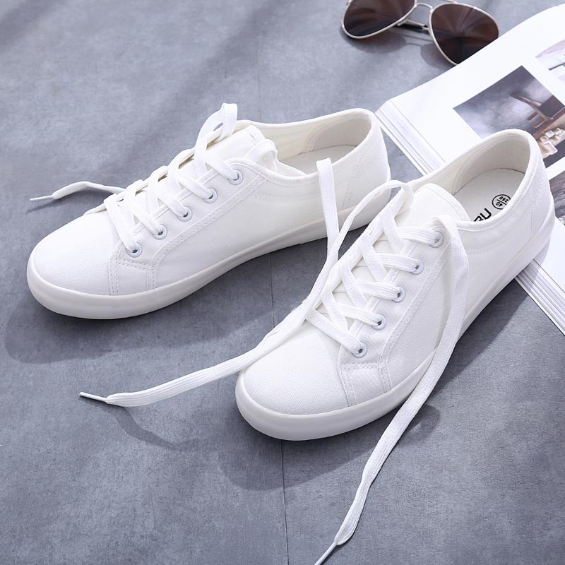 white flat trainers