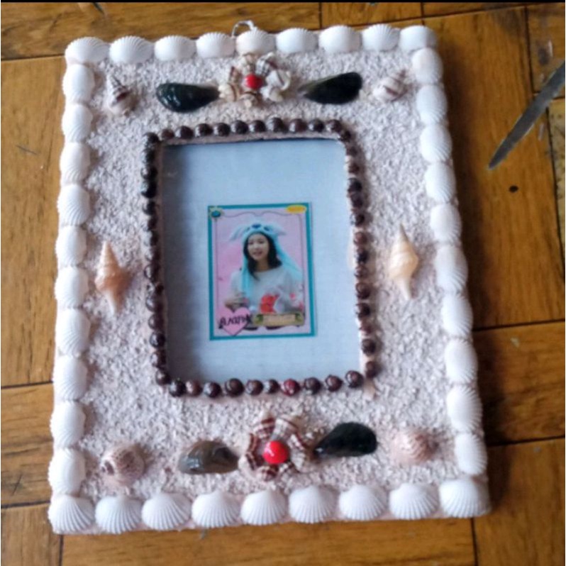 figura 3R dinding dari kerajinan kerang