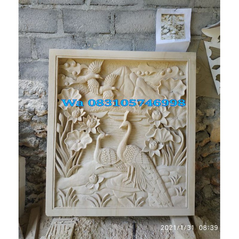 relief ukir batu paras hiasan dinding