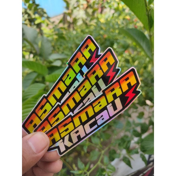 

Stiker HOLOGRAM tulisan "AsmaraKacau