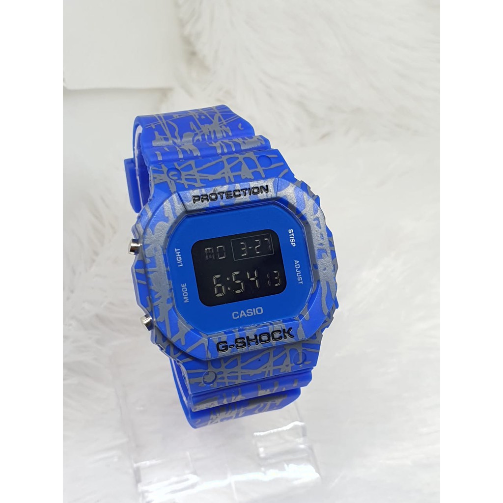 TERLARIS!!!JAM TANGAN PRIA G-SHOCK CASIO DW 5600 GS CASIO SEGI WARNA HITAM ANTI AIR DIGITAL one piece dw bunga dw loreng full hitam best seller ready stock TERIMA COD BAYAR DITEMPAT-TRIBAL BIRU