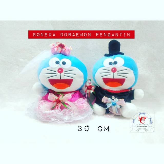 boneka doraemon wedding gaun pink