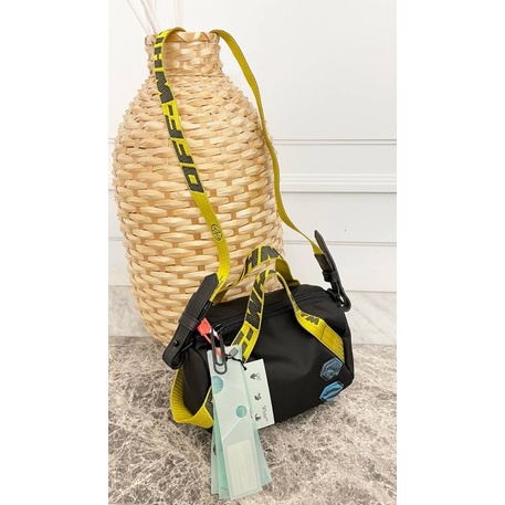 off white nylon duffle bag