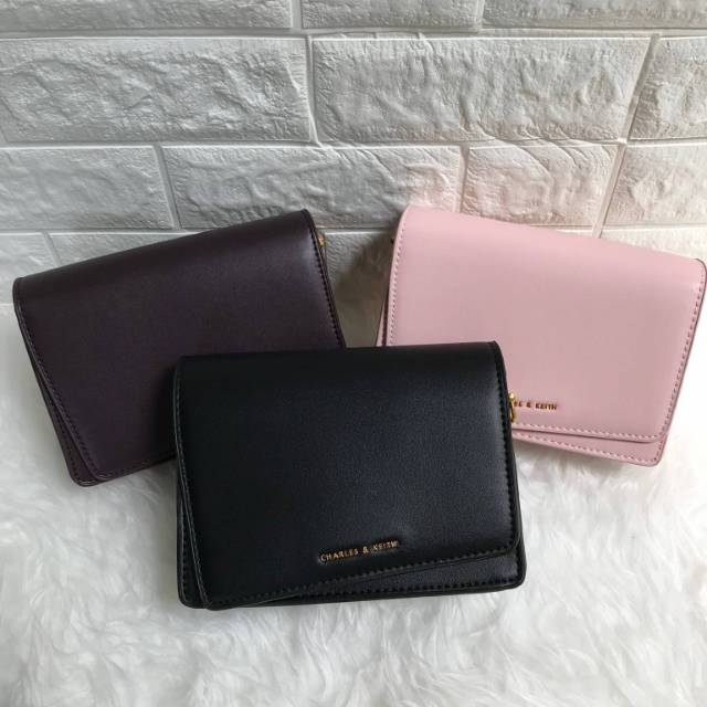 charles and keith asymmetric front flap bag