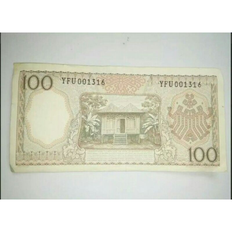 UANG KUNO 100 RUPIAH TAHUN 1964 EDISI PEKERJA MERAH