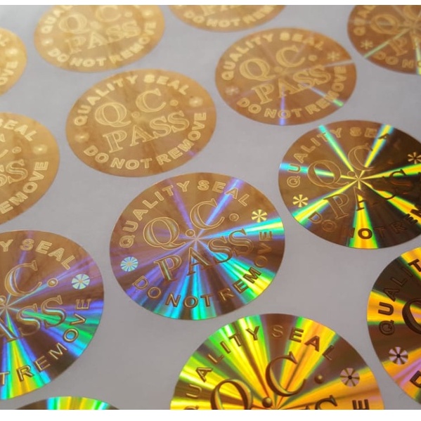 

Stiker Hologram QC Pass Extra besar Gold Diameter 3.5 cm