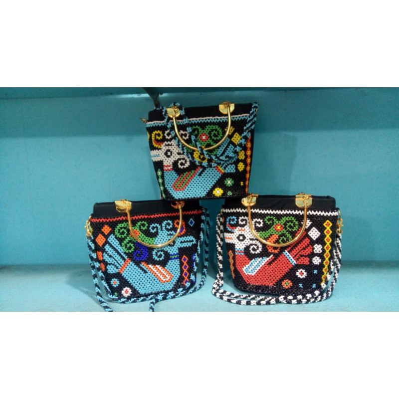 tas manik etnik dayak kalimantan motif burung enggang