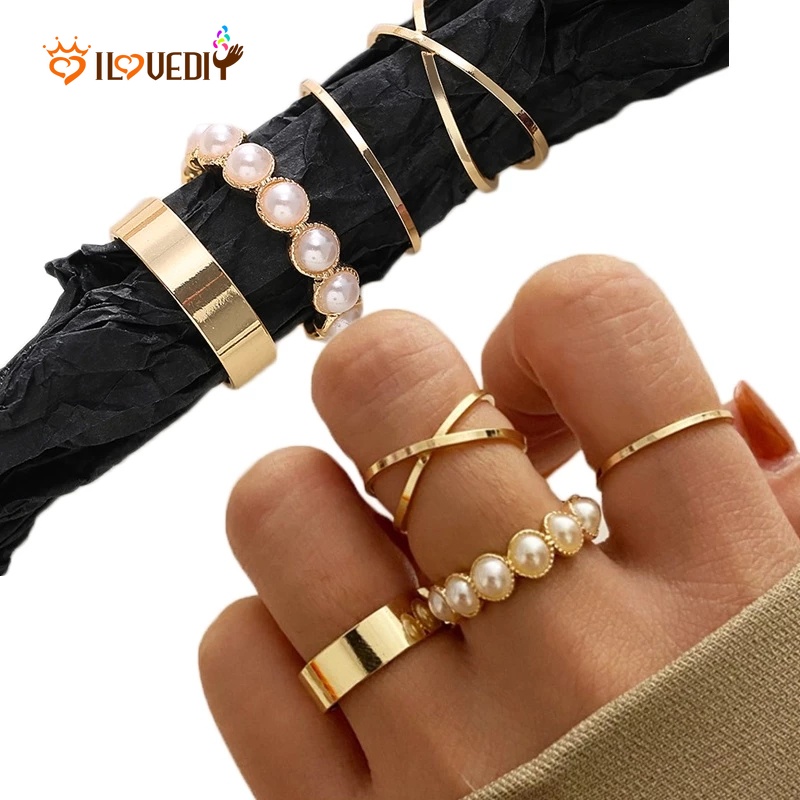 4pcs / Set Cincin Jari Wanita Desain Geometri Twist Hollow Hias Mutiara Gaya Vintage