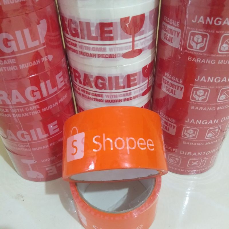 

Isolasi / Lakban Fragile - Lakban Shopee - Jangan Dibanting Warna Merah Putih Ukuran 2 Inch 50 Yard