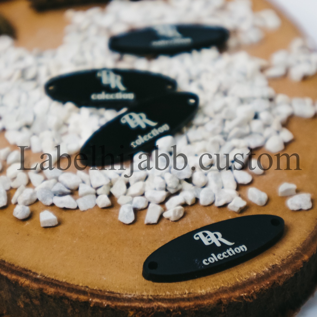 

label hijab | label baju | label akrilik | custom label | label jilbab | label cutting | label Mukena