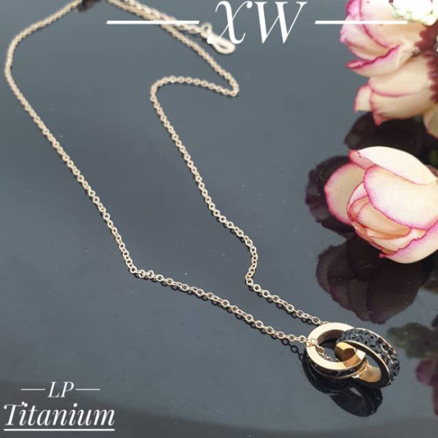 Kalung titanium rosegold mata hitam