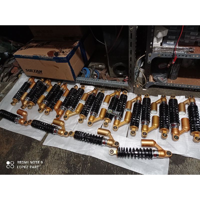 skok shock belakang tirev showa impor