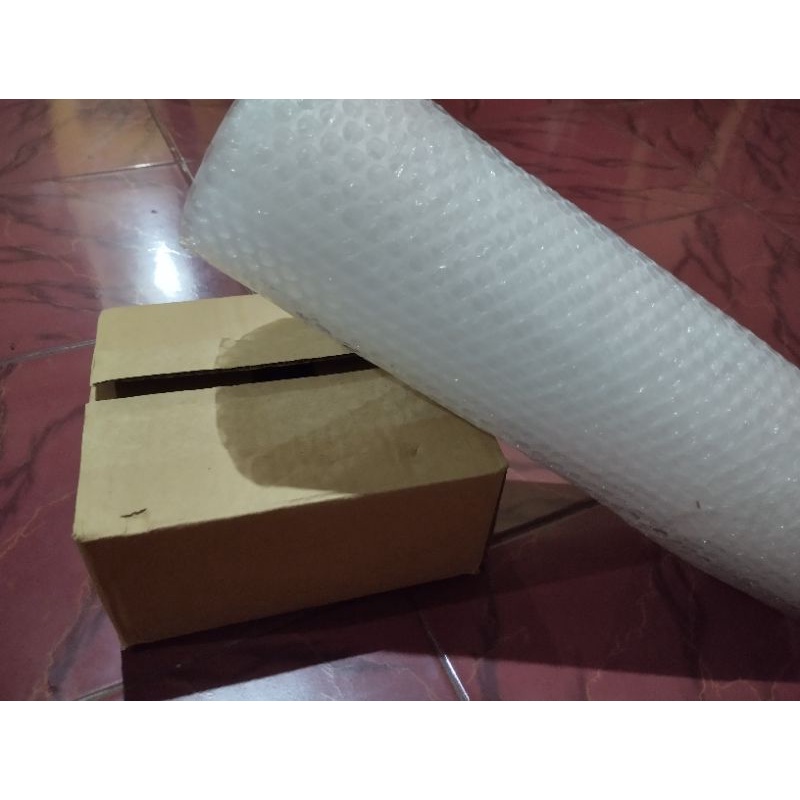 

Bubble wrap dan kardus packing