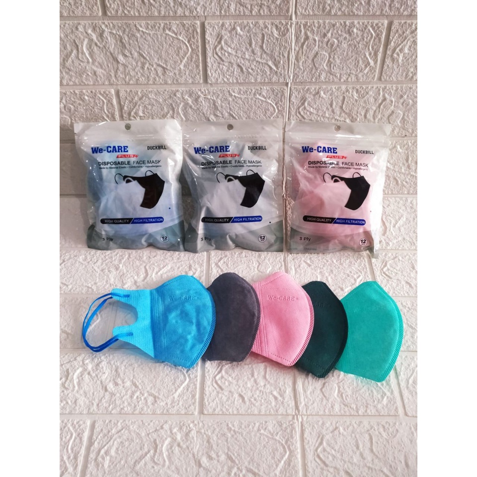 MASKER DUCKBILL WARNA WE-CARE PLUS / MASKER DUCKBILL WARNA WE-CARE PLUS EARLOOP ISI 12