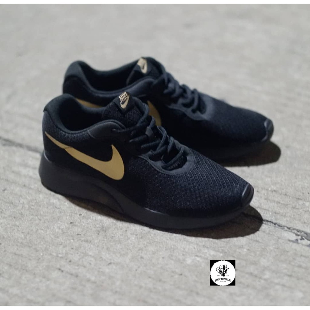 nike black and gold tanjun