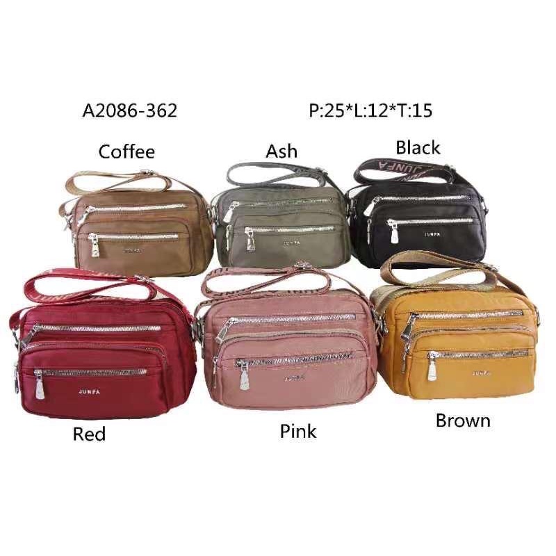 Tas selempang Junfa Bahan Parasut Terbaru. Size 27x12x15 cm. Tas Wanita Tas Selempang wanita Import Tas Junfa Import BEST SELLER TERBARU BISA BAYAR DITEMPAT.!!!!