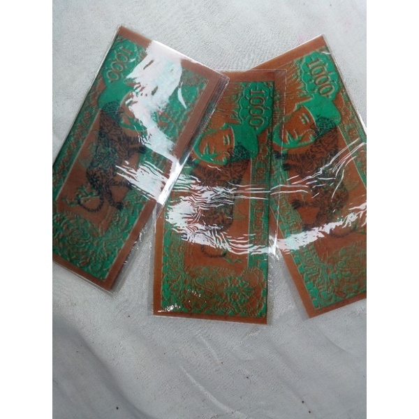 uang soekarno lengkung simbol macan