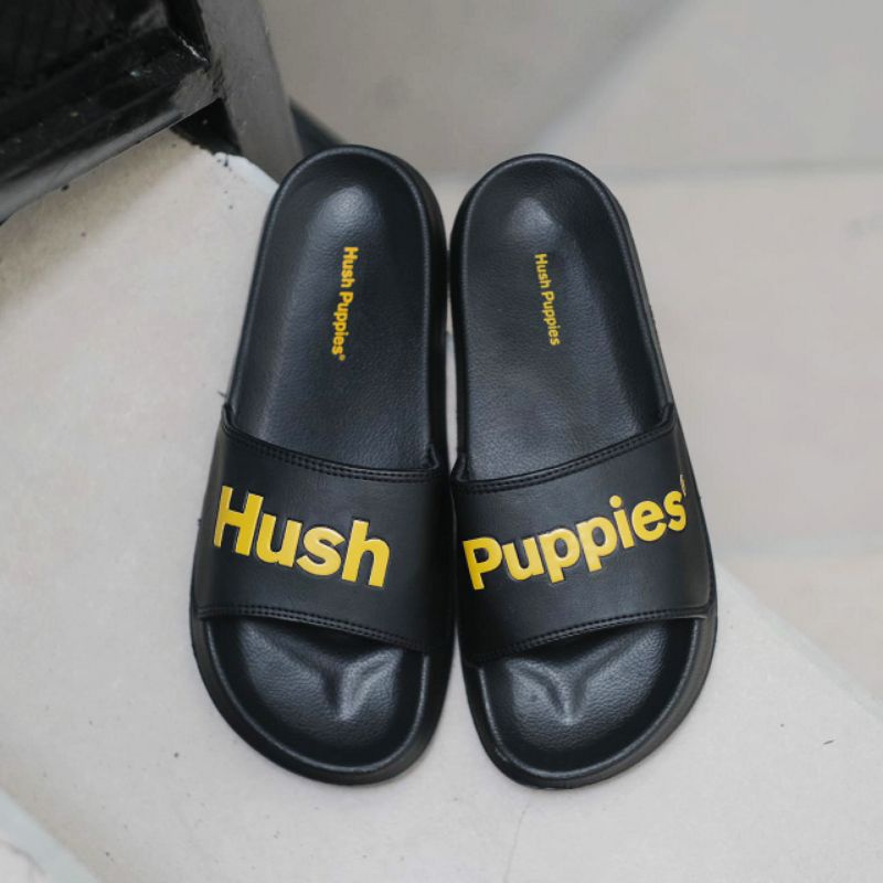 SANDAL HUSH PUPPIES BIG TEXT BLACK GOLD