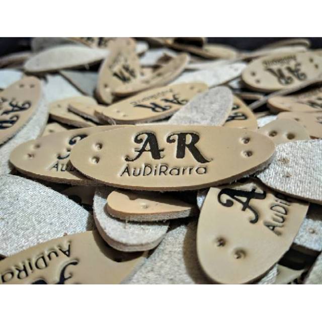 Label kulit sintetis embos