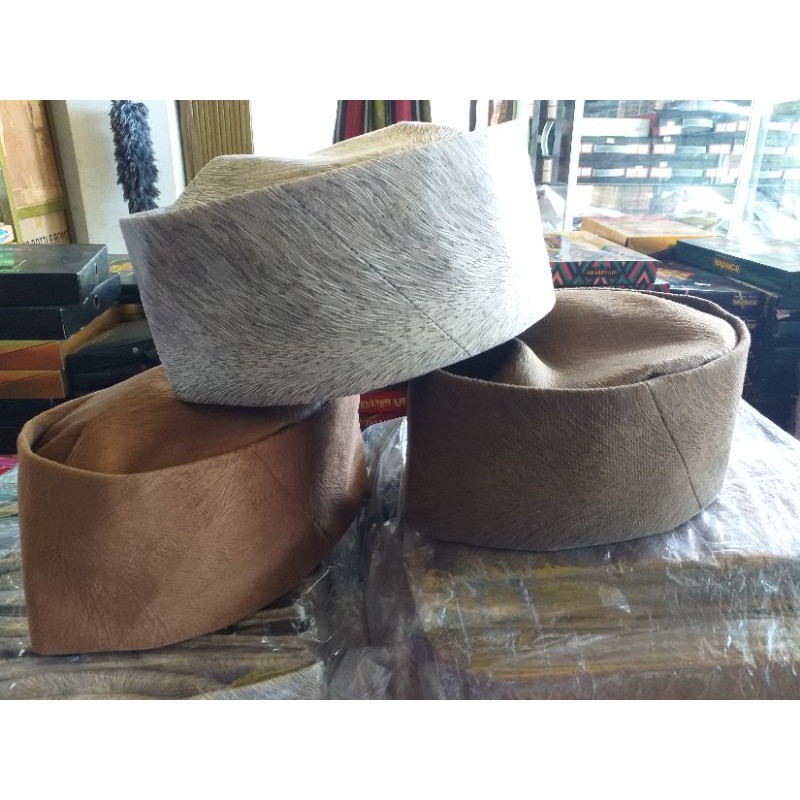 peci motif bulu landak