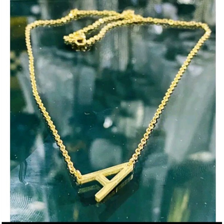 kalung huruf titan